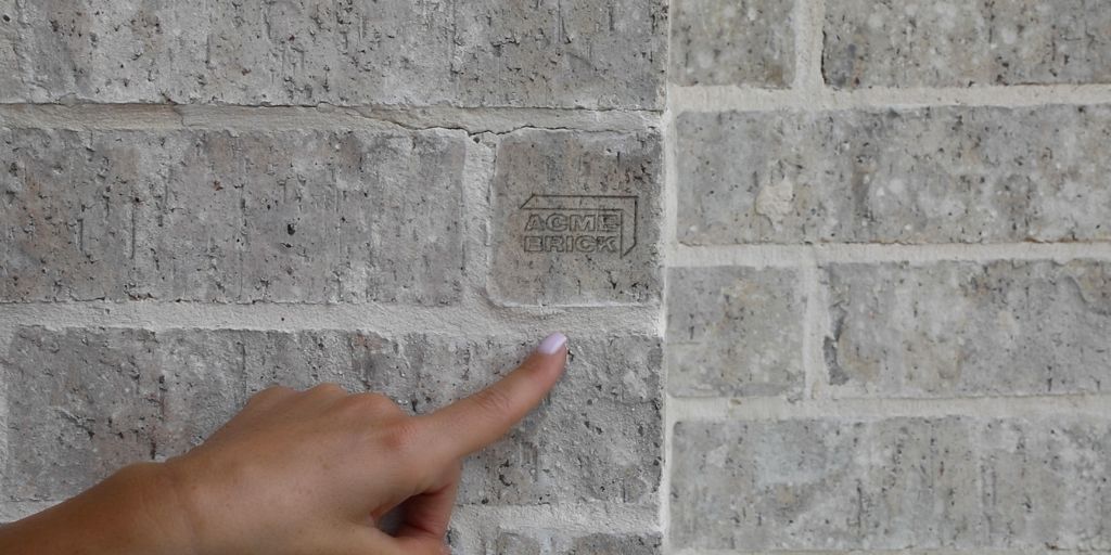 Closeup of brick with Acme Brick logo