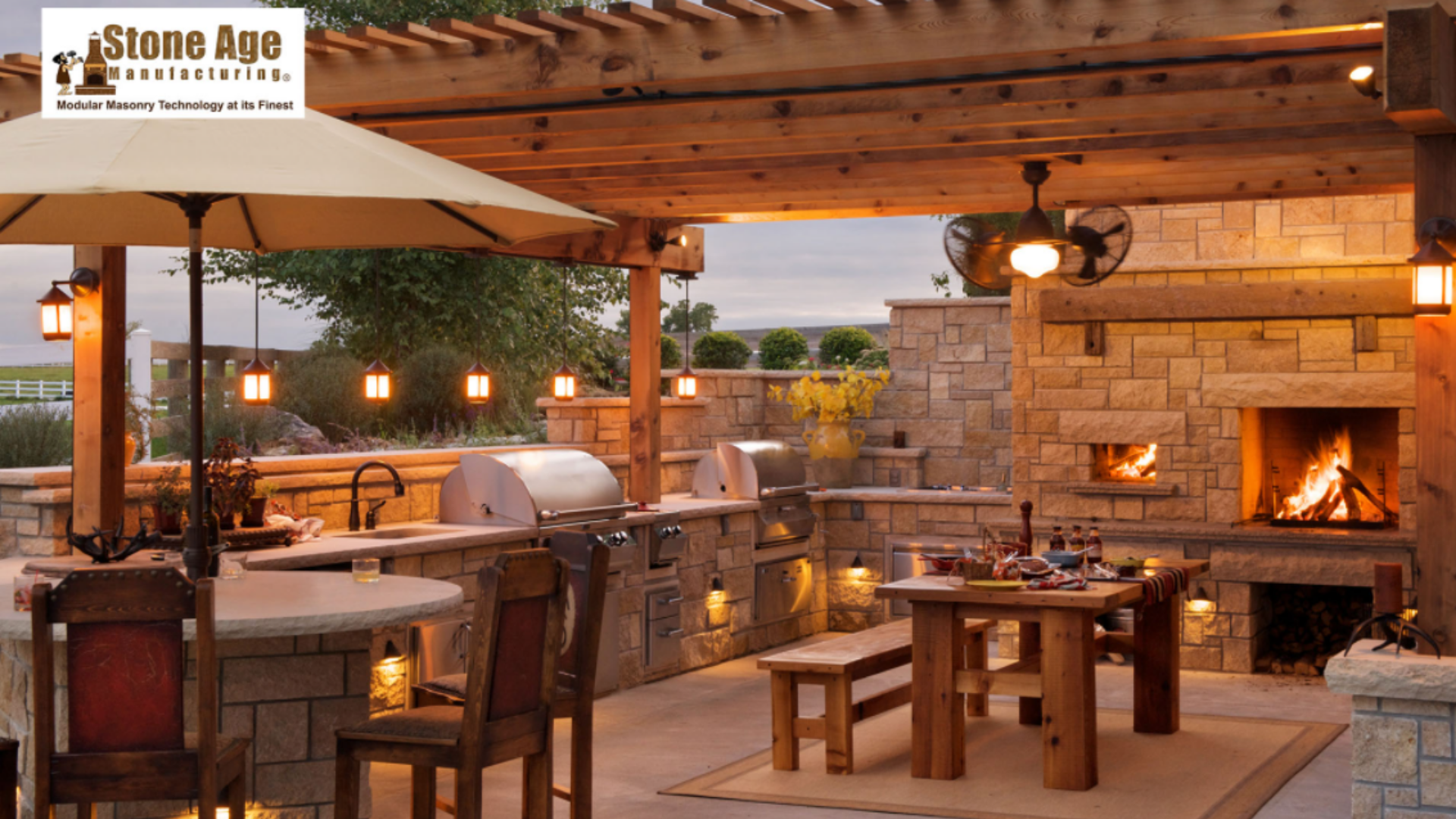 home backyard entertainment space with kitchen and fireplace