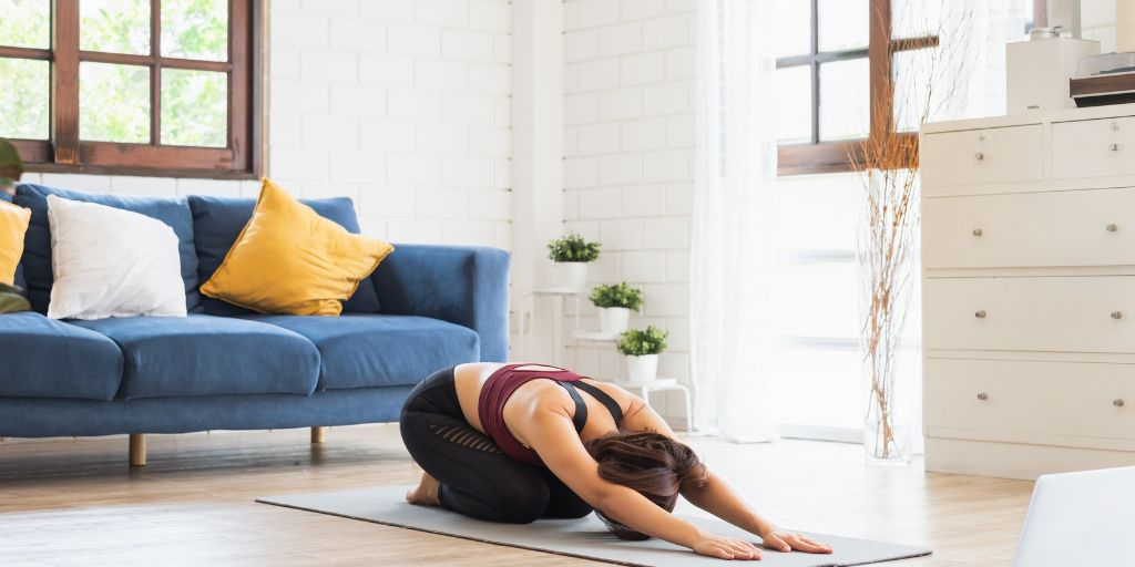 woman in a yoga post at home