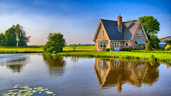 Small brick guest house overlooking a pond