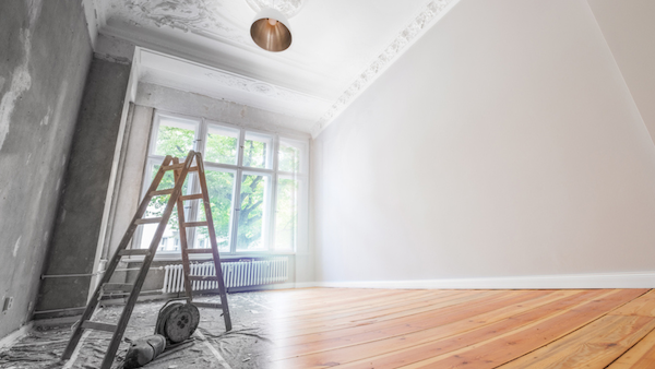 Interior room renovation. Split photo of work in progress vs finished product