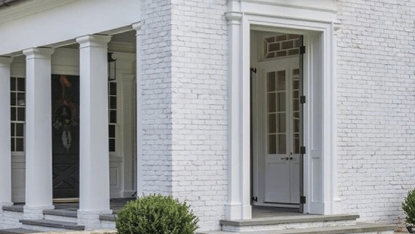 white painted brick on the outside of a home