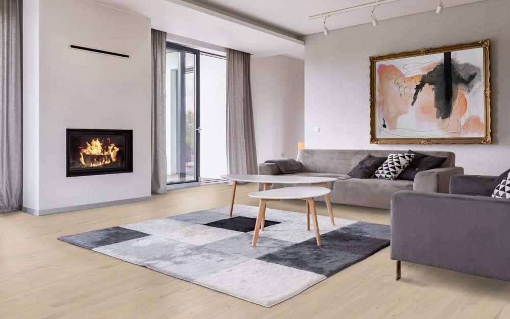 Modern living room with fireplace, sofa, balcony and pattern carpet
