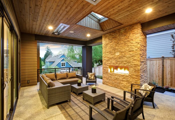 Dreamy,Outdoor,Covered,Patio,With,Stone,Fireplace,,A,Beadboard,Ceiling